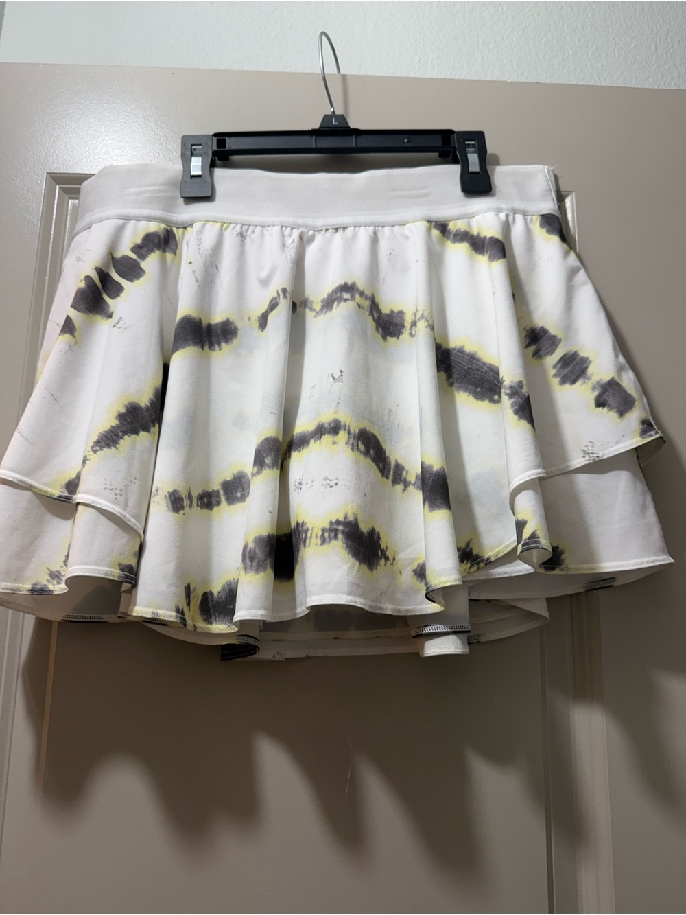 Lululemon White Tie-Dye Flared Skirt and shorts under with Yellow & Blac